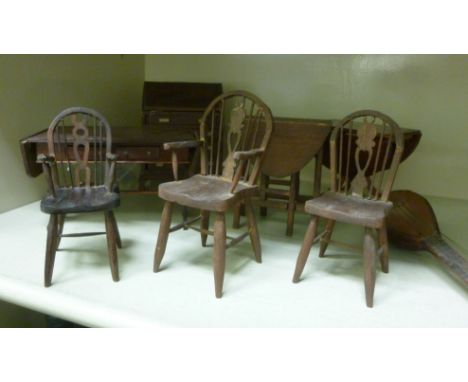 20thC dolls house furniture: to include three stained beech hoop and stick back Windsor chairs       OS6
