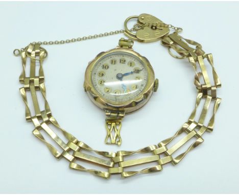 A lady's 9ct gold wristwatch head and a 9ct gold gate bracelet, 19.9g gross weight, (bracelet 7.2g) 