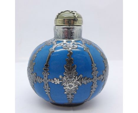 A Chinese scent bottle with white metal overlaid decoration and jade stopper, 7.5cm