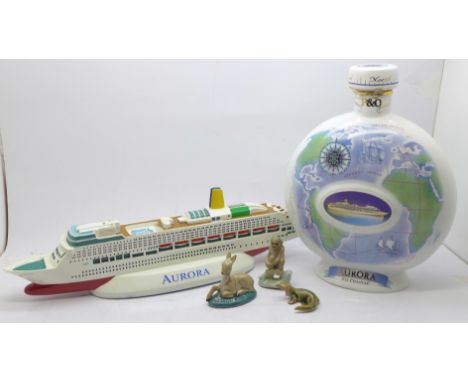 A Wade Cognac flask, lacking contents, a model of a cruise ship Aurora, two Wade Whimsies and one other figure 