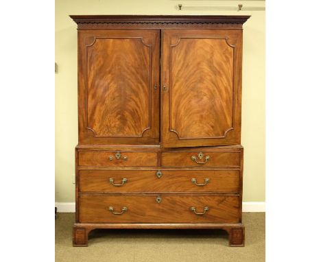 George III mahogany converted linen press, having a moulded dentil cornice, doors opening to reveal a hanging interior, the b