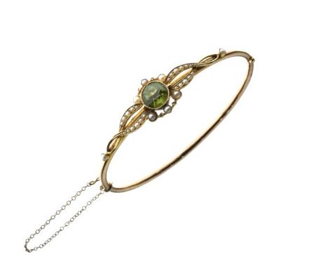 Unmarked yellow metal snap bangle set seed pearls and green stone, 7.6g gross approx   Condition: 