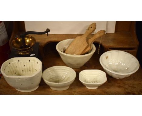 Five off-white glazed pottery jelly moulds, a vintage coffee grinder and four butter pats   Condition: 