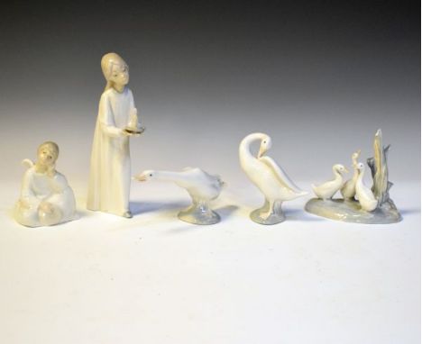 Lladro figure of a young girl in a nightgown, two Lladro figures of ducks and two Nao figures   Condition: 