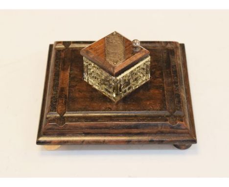 George V ebonised inkstand, the glass inkwell having a silver mount hallmarked for London 1912   Condition: 