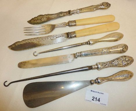 Silver handled button hooks and flatware - together with a fish knife and fork with a silver blade and tines