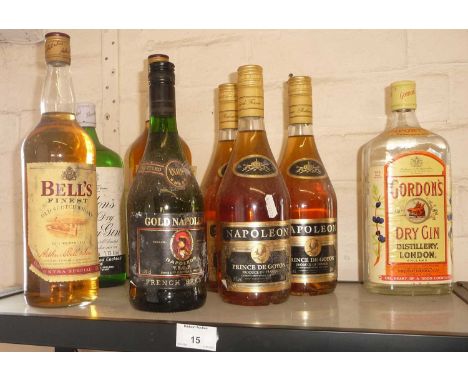 Three bottles of vintage brandy, two whisky bottles and two bottles of Gordons gin