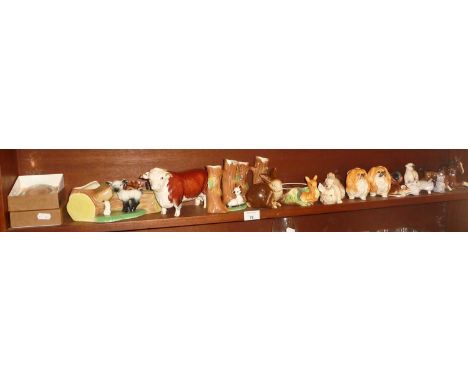 Assorted china animal figurines, inc. Beswick pigs, Sylvac Pekinese dogs, Aberdeen Angus bull, a Poole Pottery rat, Beswick f