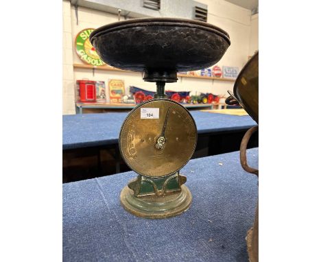 A vintage brass faced Salters family scales, model number 50