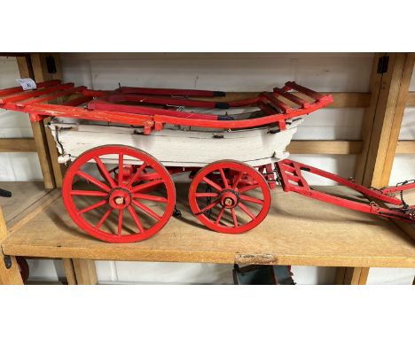 A scratch built model of a Hereford Wagon, painted in red and cream, approx 70cm long in total