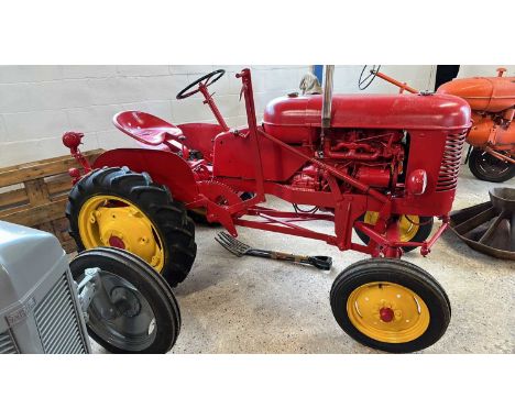 A Massey vintage Tractor, in fully restored condition, reported running by vendor when placed into storage