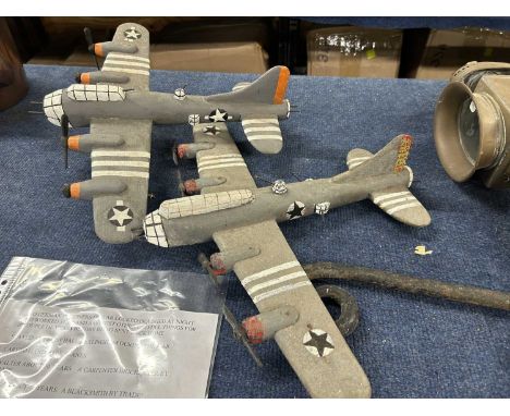 Two prisoner of war carved model aircraft produced by German prisoners of war staying at Saxlingham, largest 47cm wide