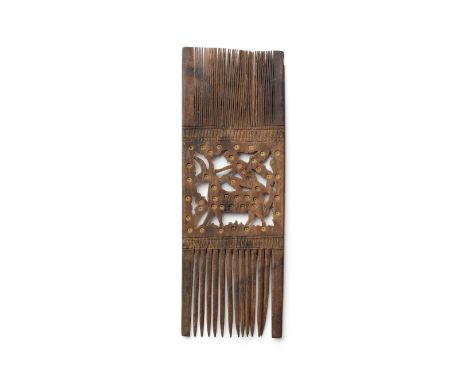  A Coptic Wood comb Circa 7th-8th Century A.D.With a central panel of openwork decoration carved with a figure atop a quadrup