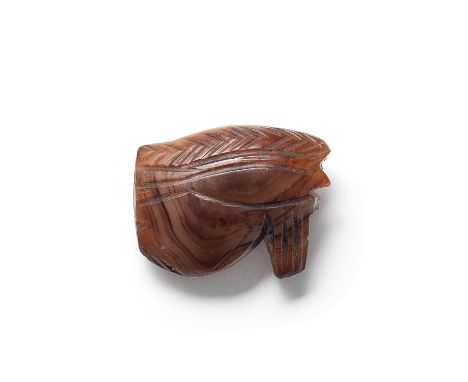  An Egyptian carnelian Eye of Horus Third Intermediate Period, circa 1069-664 B.C.Convex on both faces, with engraved chevron