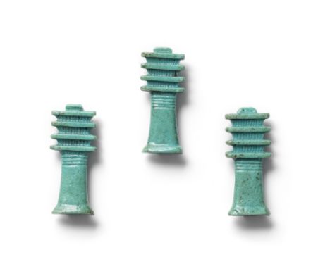  Three Egyptian faience Djed pillars Late Period, 26th Dynasty, circa 664-525 B.C.Each with ribbed capital surmounted by four