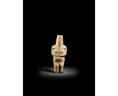  A Cycladic marble female idol Early Precanonical Type, Early Cycladic I/II,  circa 2800 B.C.The long neck emerging from angu