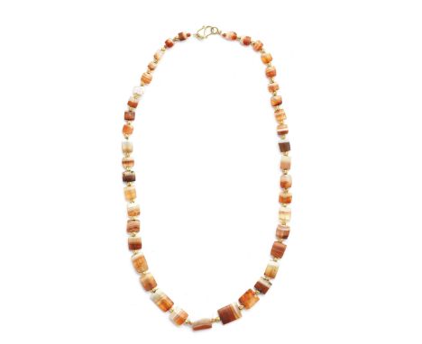  A Bactrian banded agate necklace Circa late 3rd-early 2nd Millennium B.C. Composed of 41 small convex rectangular beads, gra