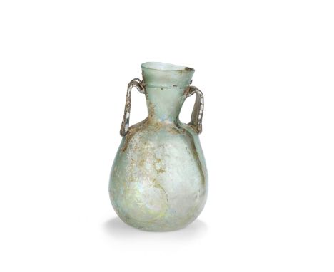  A large Late Roman blue-green glass amphora Circa 4th-5th Century A.D.With a band of trail decoration around the funnel neck