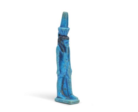  An Egyptian brilliant blue faience amulet of Nefertum Third Intermediate Period-26th Dynasty, circa 1069-525 B.C.The short-k