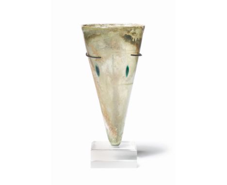  A Late Roman glass lamp or cup Circa 4th-5th Century A.D.Of conical form, tapering to a rounded base, decorated with three e