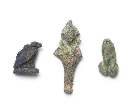 An Egyptian lapis lazuli vulture amulet and an Egyptian miniature iridescent glass Osiris amulet Late Period-Ptolemaic Perio