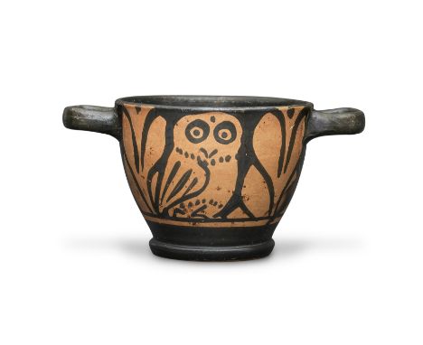  A Greek red-figure owl skyphos South Italy, circa 4th Century B.C.Decorated on each side with an owl depicted with dot and c