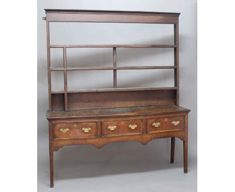 OAK DRESSER, 18th century, the three shelf plate rack on a base with three crossbanded drawers, height 205cm, width 174cm, de