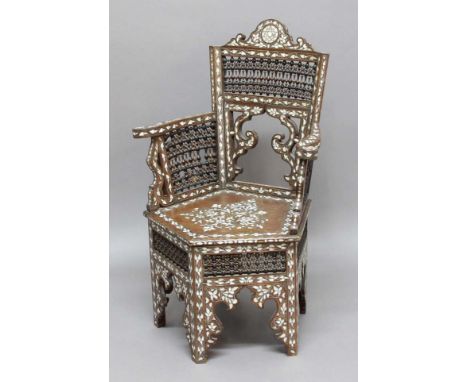 MOORISH STYLE INLAID ELBOW CHAIR, the scrolled top rail above a fine, spindle back above an ogee arch and outswept arms, a pe