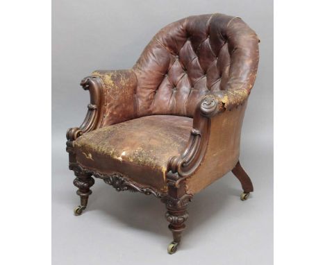 WILLIAM IV WALNUT  AND LEATHER UPHOLSTERED LIBRARY CLUB CHAIR, the arched, button back above scrolling arms with carved flora