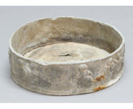 CIRCULAR LEAD PLANTER, the sides cast with cherubs at play, height 11.5cm, diameter 40cm