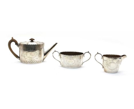 A composed silver three piece tea service, the teapot by Henry William Curry, London 1881, the cream jug and sugar bowl by Fo