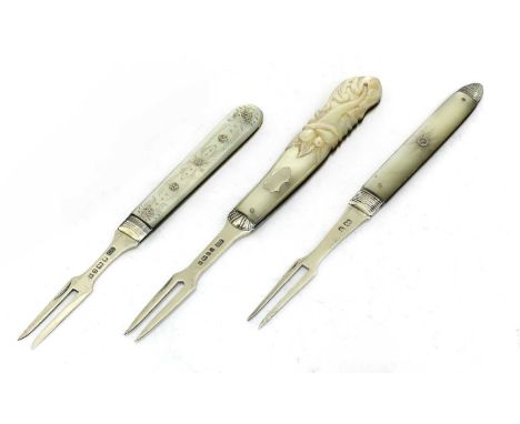 Three silver and mother-of-pearl folding fruit forks, the first with lion passant and duty marks (only) the handles wtih silv