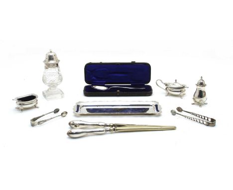 A silver three piece cruet set on stand, by Joseph Gloster Ltd, one spoon associated, a cased silver spoon by Henry Hobson &a