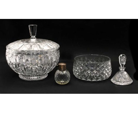 A large cut glass punch bowl and cover, 20th century, with a tall faceted finial, 27cm high, a further bowl, a plate, a servi