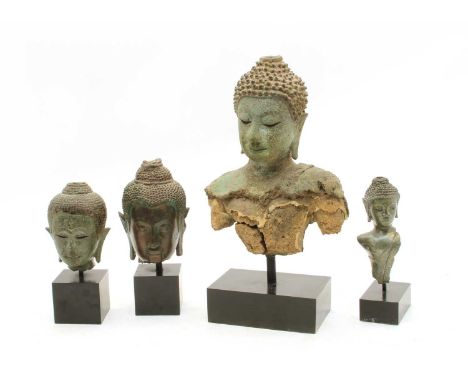 Four Java bronze, of Buddha's heads, 11.5 to 26cm high (4)