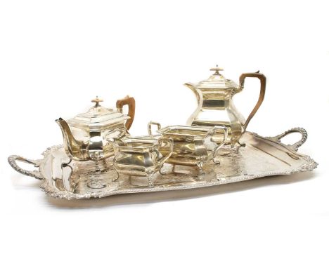 A four piece silver teaset, maker ABD, Sheffield 1928, comprising teapot, hot water pot, sugar and cream, of facetted baluste