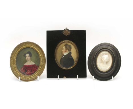 An Edwardian miniature portrait of a woman in a red dress, 9cm x 7cm, a miniature portrait of a gentleman, 8cm x 6.5cm, in eb