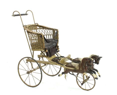 An early 20th century child's carriage, bearing original label 'Tall oaks from little acorns grow, Holborn, London', having t