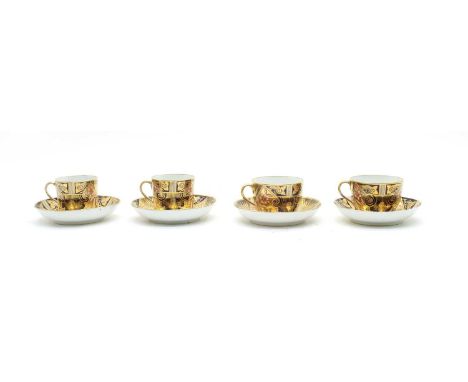 An early 19th Century porcelain part tea and coffee service, comprising seven teacups, eight coffee cans and nine saucers, ha