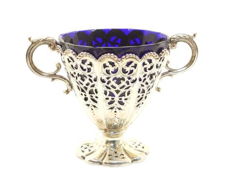 A Victorian silver pierced twin-handled bonbonniere, Henry Wilkinson &amp; Co, Sheffield 1850, the faceted body centred with 