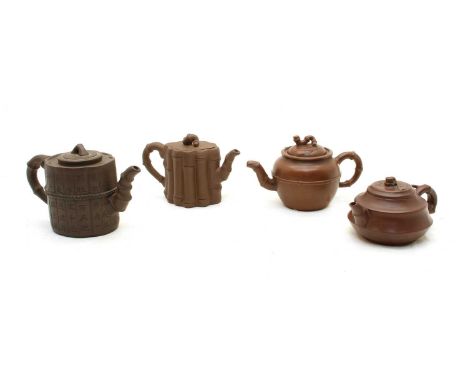 A collection of four Chinese Yixing zisha teapots, 20th century, comprising: one of cylindrical form moulded to assimilate ba
