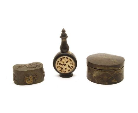 A Japanese bronze box, Meji Period, with engraved decoration depicting a bird, perched on a flowering tree, 7 x 6.5cm, togeth