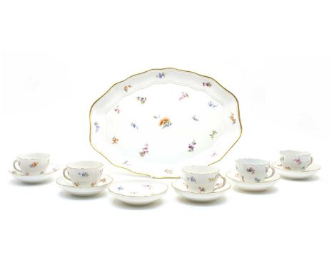 An early 20th century Meissen set of cabinet cups and saucers, the set comprising of five cups, six saucers and a tray, all h