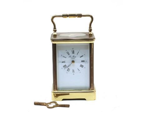 A modern French 'L'Epie' brass carriage clock, striking the half hours on a gong, dial inscribed 'St James, London', with dou