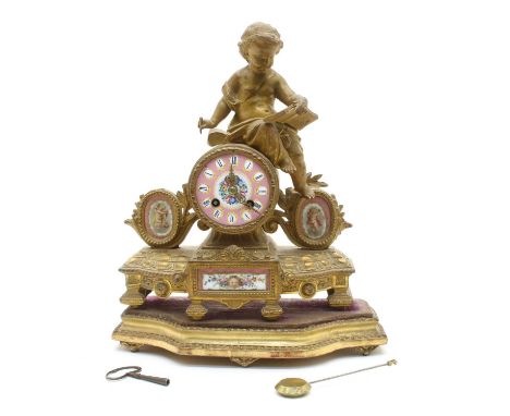 A 19th century gilt spelter mantel clock, the pink porcelain dial surmounted by putti reading a book on a separate giltwood s
