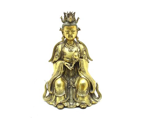 A Chinese bronze monk, 20th century, standing on a double lotus pedestal with a staff, 23cm high, and a bronze Daoist figure,