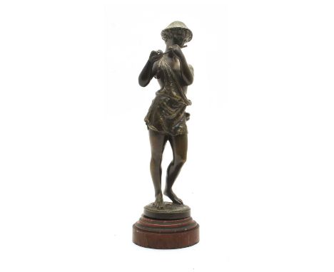 A bronze of a boy shepherd playing a pipe, signed A Richard, on a rouge marble plinth, 30.5cm highCondition report: Loose on 