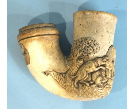 A 19th century continental meerschaum pipe bowl of large proportions, carved in relief with a pack of dogs and wolf amongst t