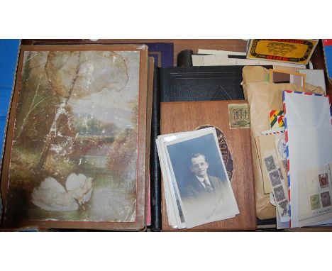 An early 20th century postcard album and contents to include; military examples, WWI sweetheart cards, Stanley Gibbons stamp 