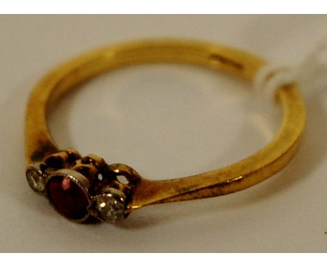 A ladies yellow gold, ruby and diamond set dress ring